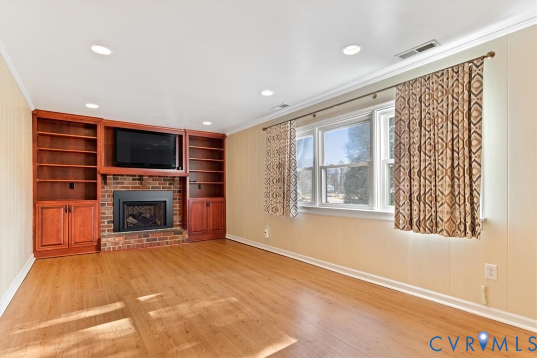 2502 Landon Road Richmond, VA 23294 - Photo 18 of 26 a view of a livingroom with a fireplace and window