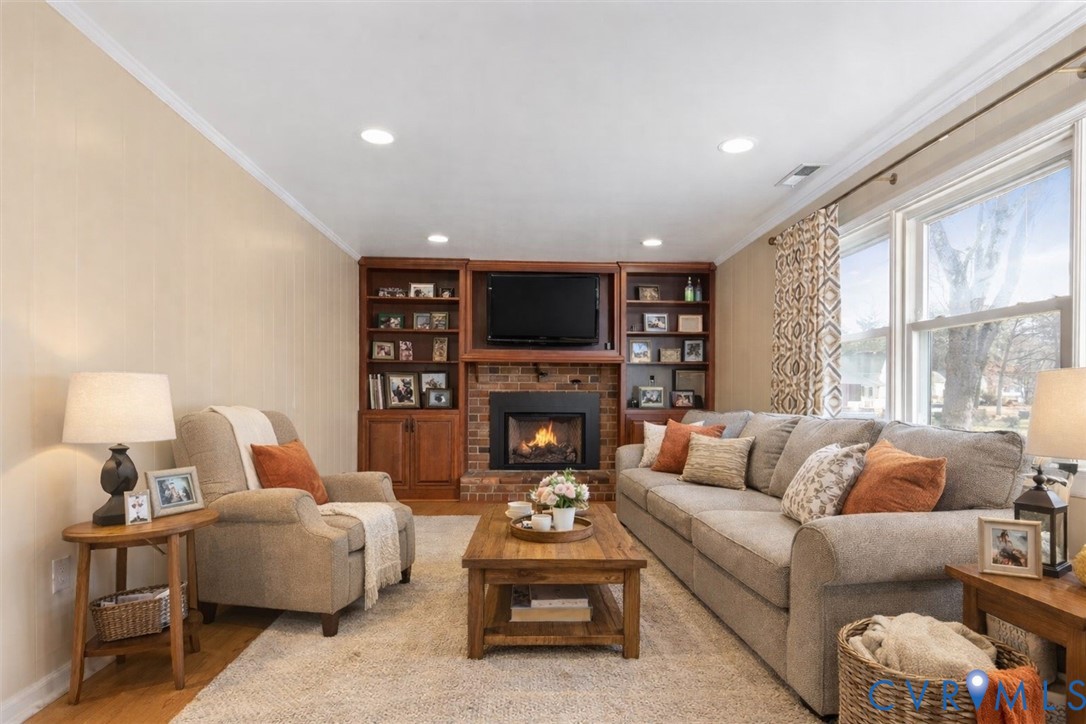 2502 Landon Road Richmond, VA 23294 - Photo 2 of 26 a living room with furniture fireplace and a large window
