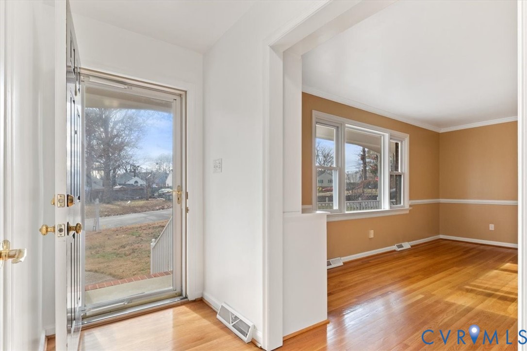 2502 Landon Road Richmond, VA 23294 - Photo 9 of 26 a view of an empty room with wooden floor and a window