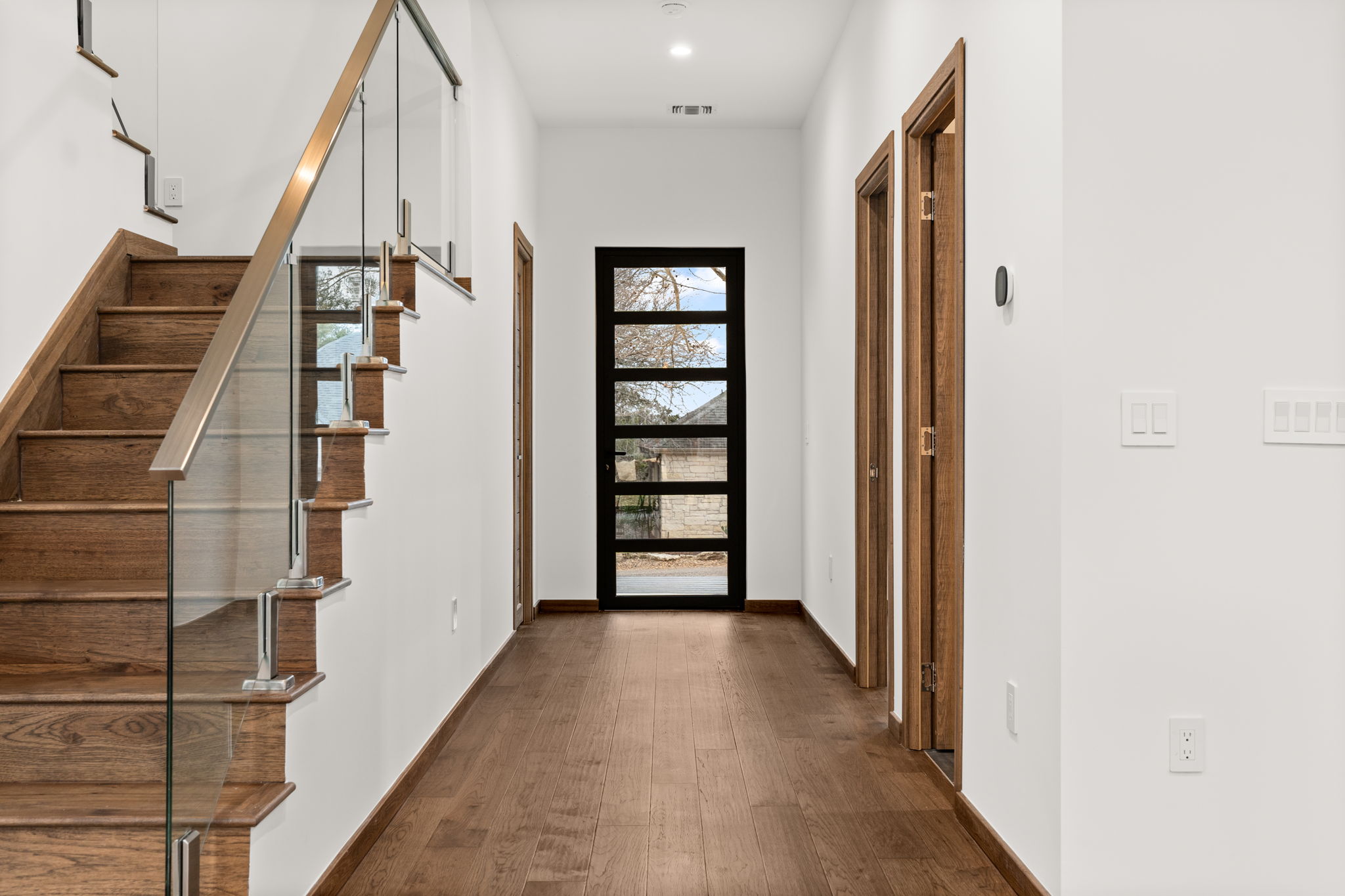 2915 Chisholm Trail Austin, TX 78734 - Photo 5 of 35 a view of a hallway with wooden floor and entryway