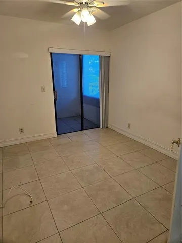 a bathroom with a sink vanity mirror and toilet