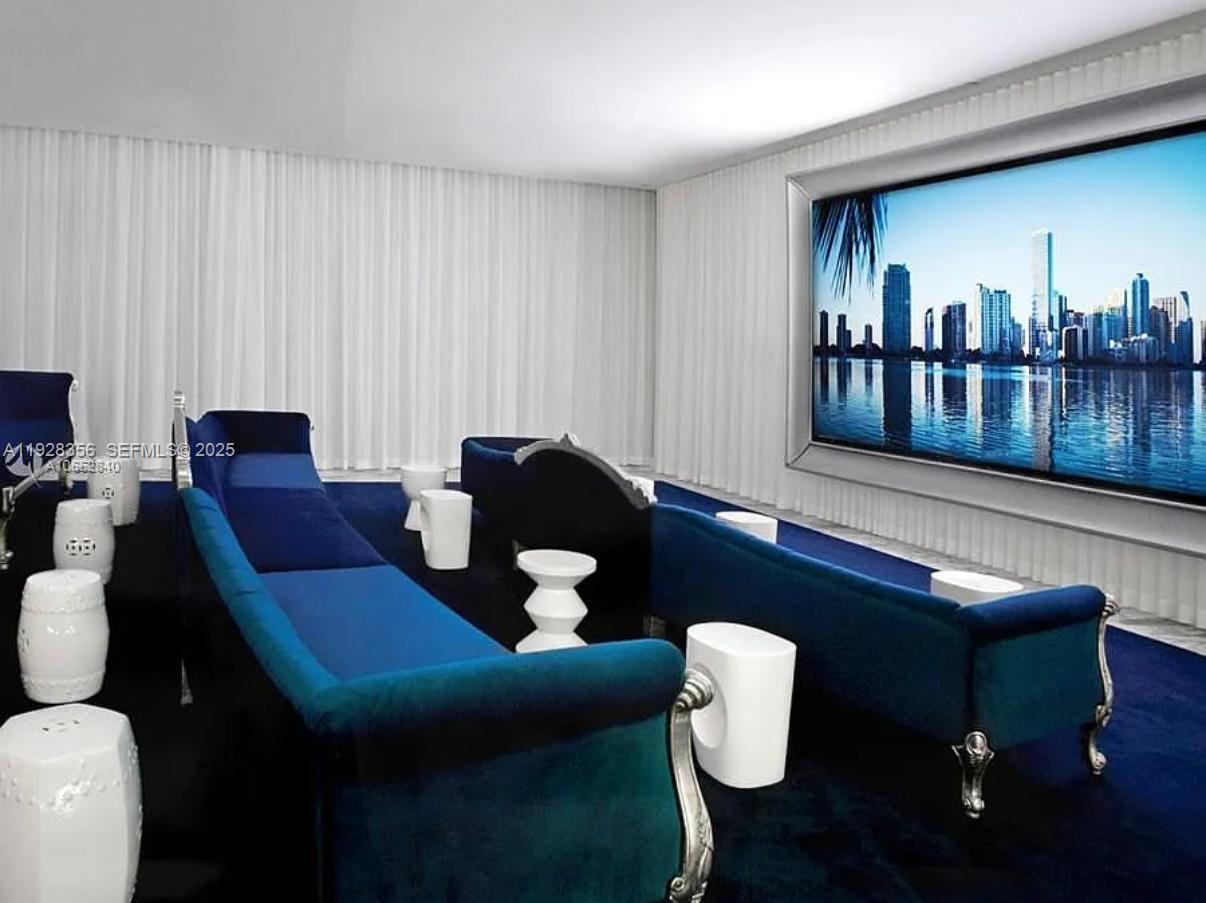 475 Brickell Avenue, Unit 5707 Miami, FL 33131 - Photo 14 of 16 a living room with furniture and a potted plant