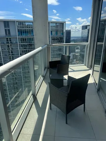 a view of a workspace with furniture