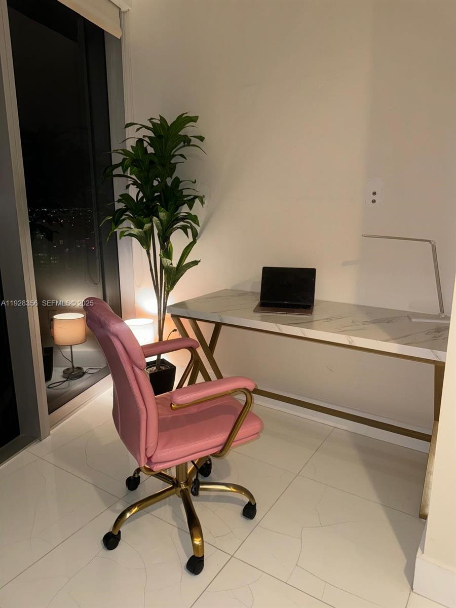 475 Brickell Avenue, Unit 5707 Miami, FL 33131 - Photo 10 of 16 a view of a workspace with furniture