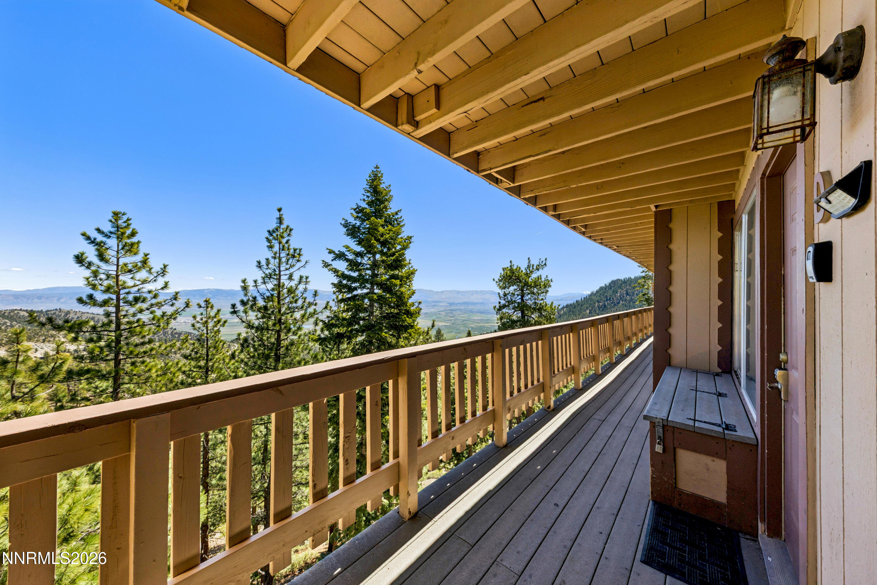 261 Quaking Aspen Lane, Unit D Stateline, NV 89449 - Photo 20 of 44 a balcony with wooden floor and outdoor space