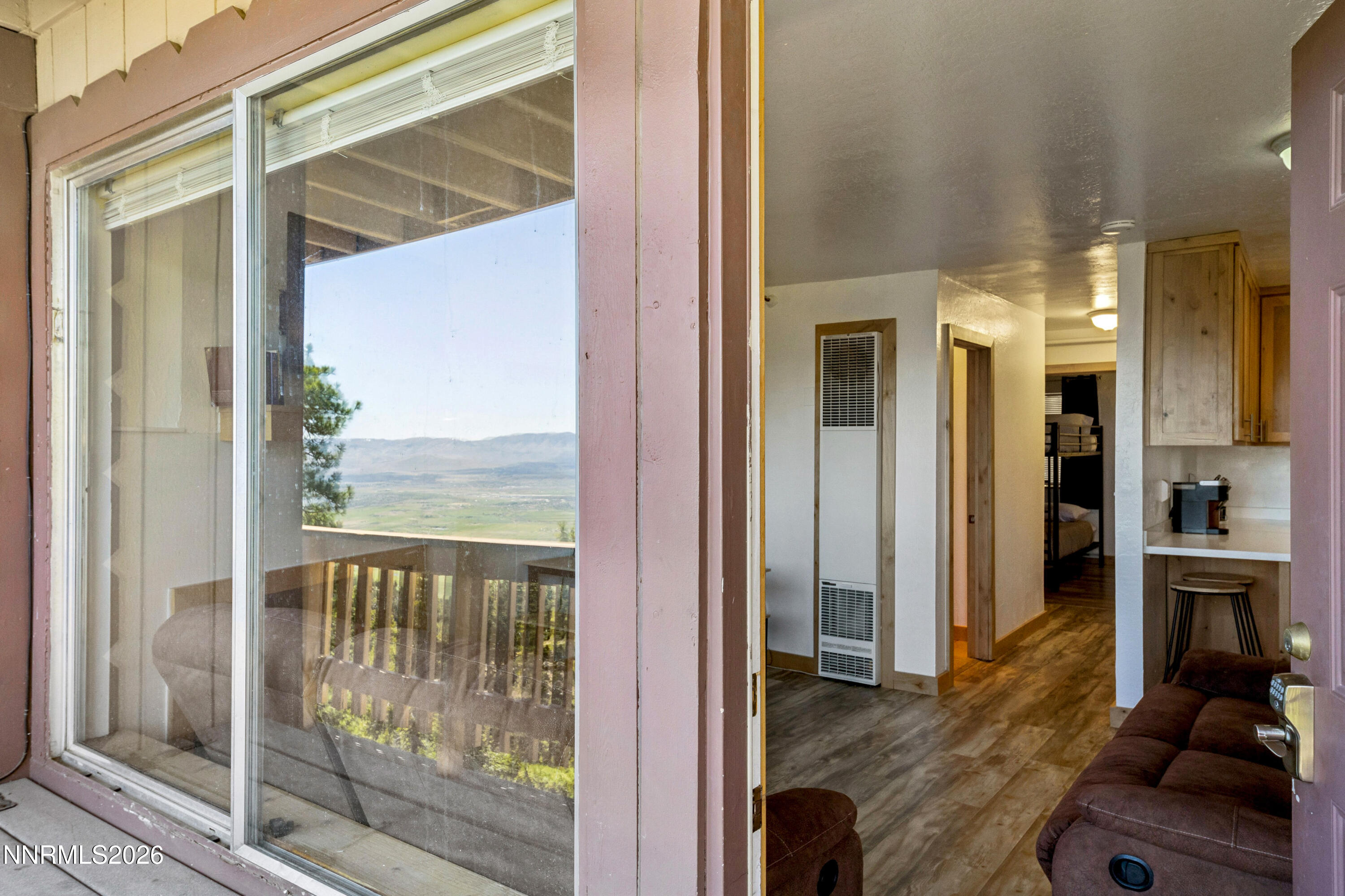 261 Quaking Aspen Lane, Unit D Stateline, NV 89449 - Photo 24 of 44 a view of a living room and a balcony