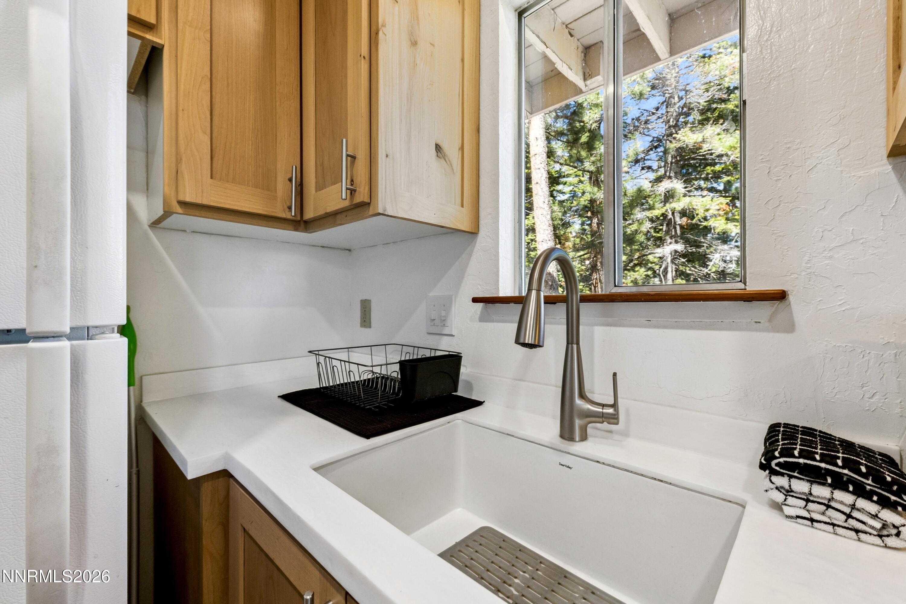 261 Quaking Aspen Lane, Unit D Stateline, NV 89449 - Photo 31 of 44 a kitchen with a stove a sink and a microwave