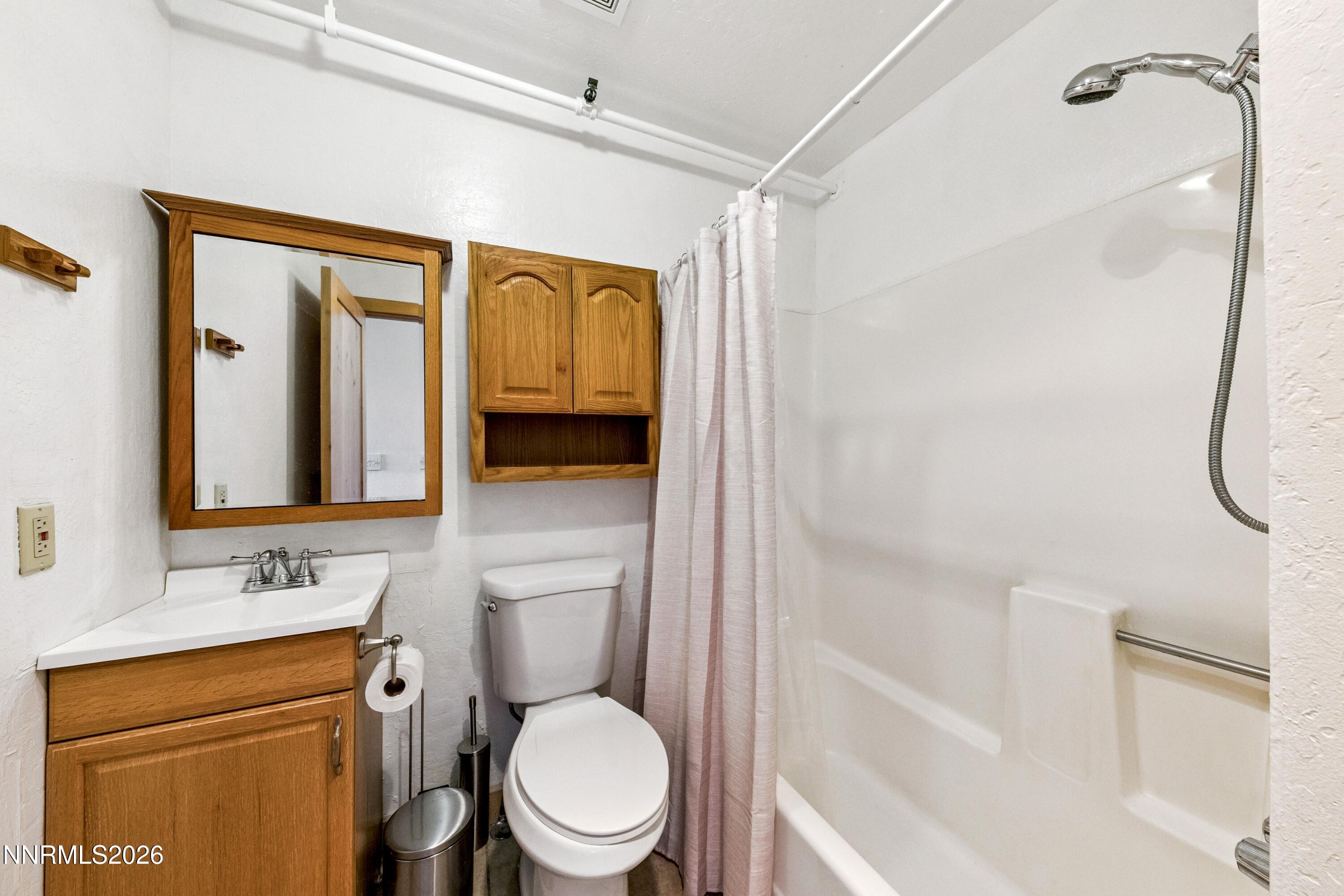 261 Quaking Aspen Lane, Unit D Stateline, NV 89449 - Photo 34 of 44 a bathroom with a toilet sink shower and mirror