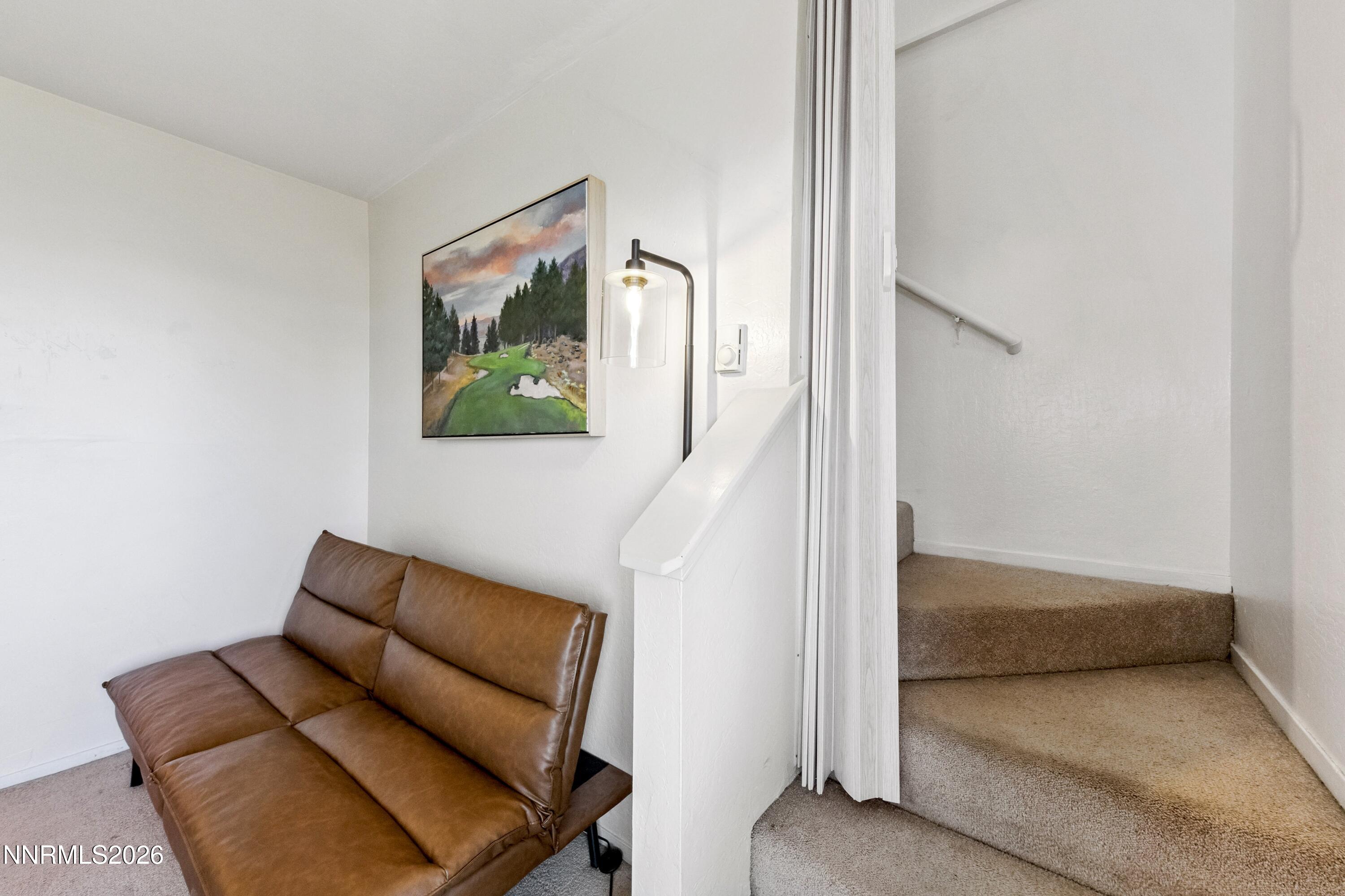 261 Quaking Aspen Lane, Unit D Stateline, NV 89449 - Photo 37 of 44 a living room with furniture and a gate