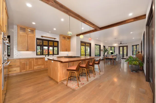 wooden floor in an empty room with a window and wooden floor