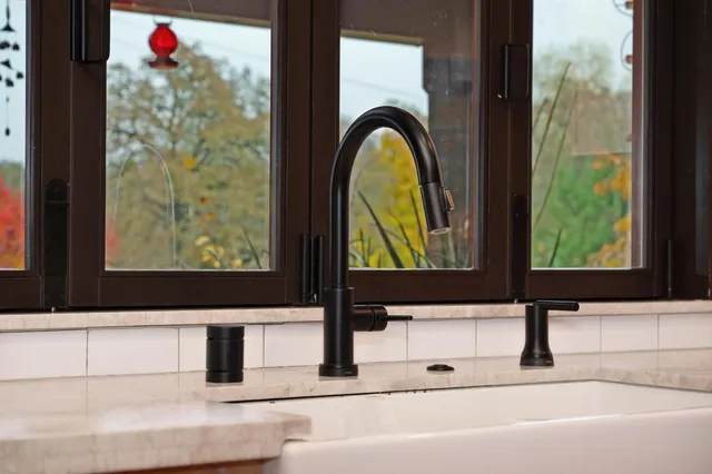 a living room with lots of furniture and a wooden floor