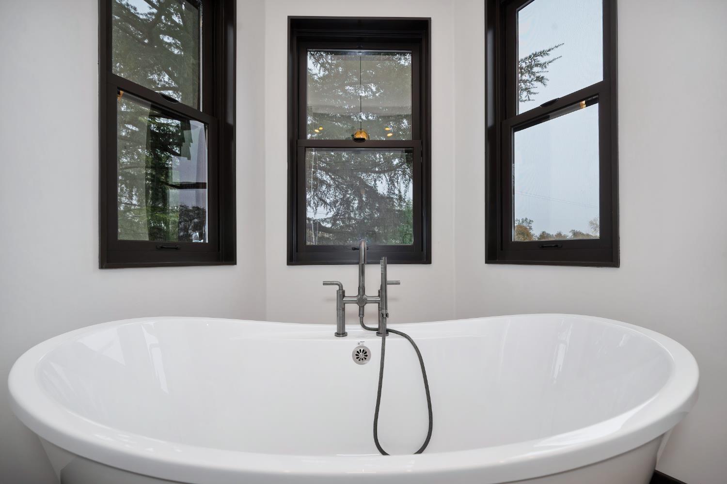 9475 King Road Loomis, CA 95650 - Photo 40 of 96 a white bath tub sitting in a bathroom next to a window