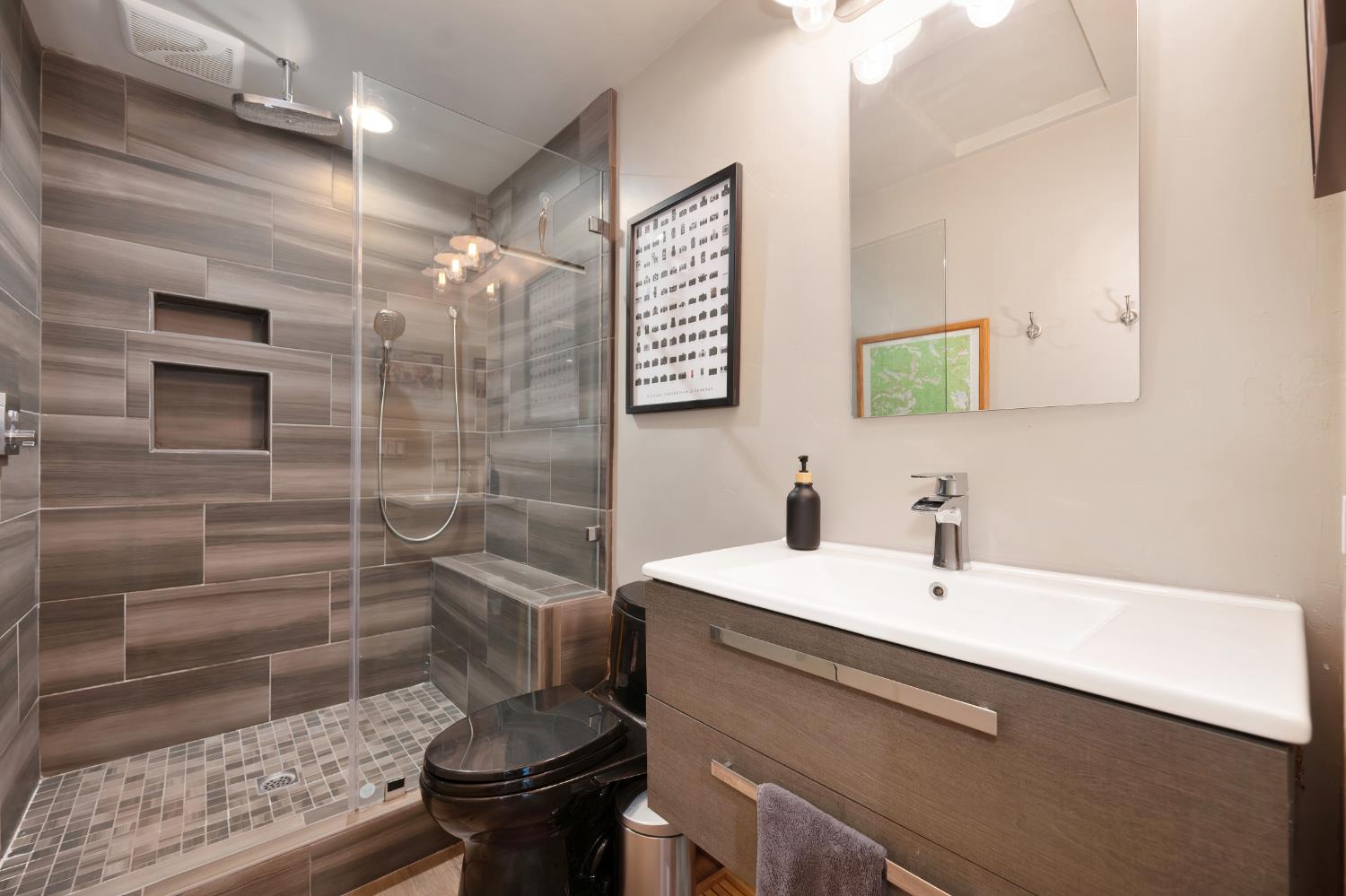 9475 King Road Loomis, CA 95650 - Photo 79 of 96 a bathroom with a sink a toilet and shower