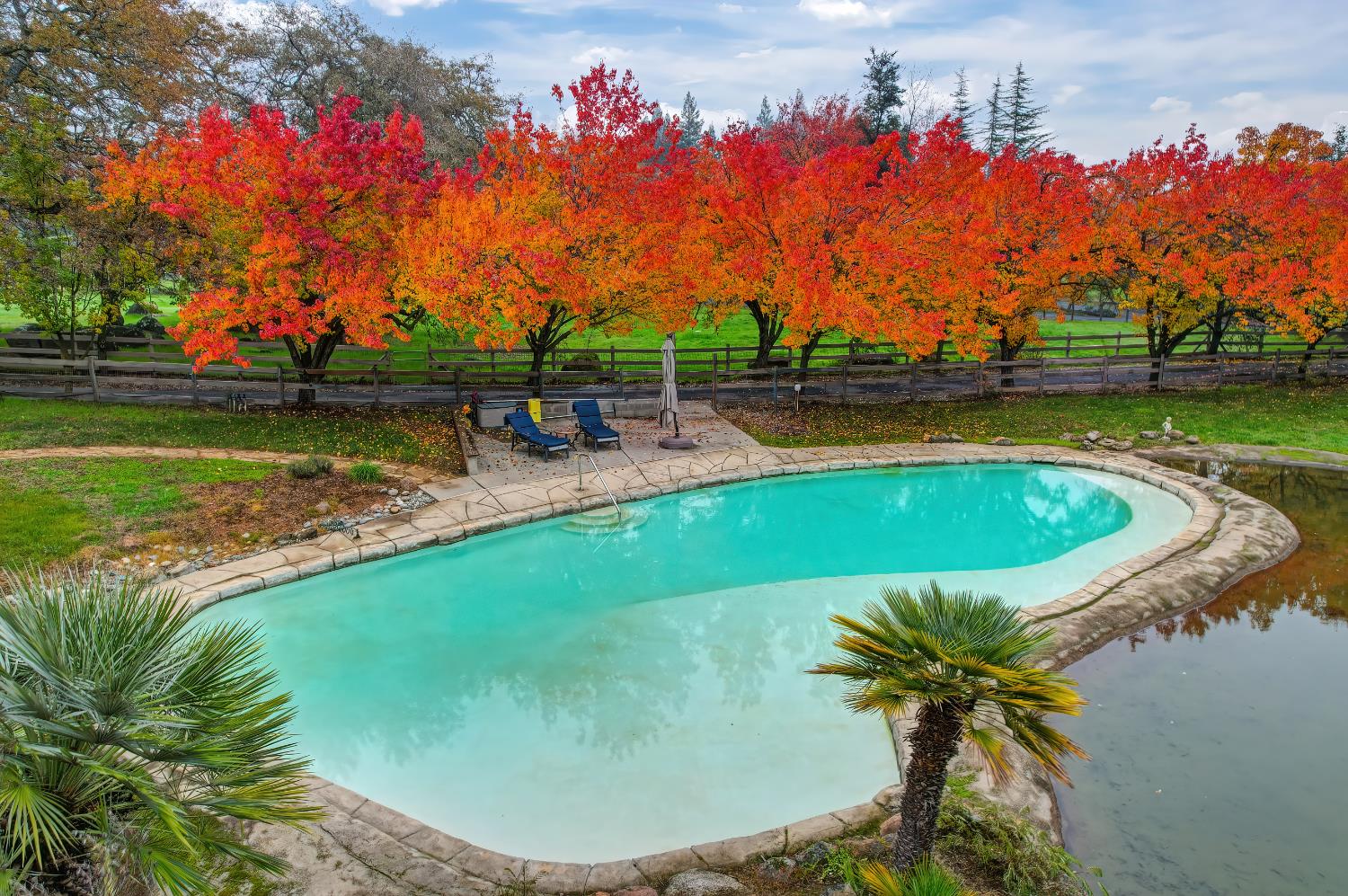 9475 King Road Loomis, CA 95650 - Photo 86 of 96 a view of a swimming pool with a lake view