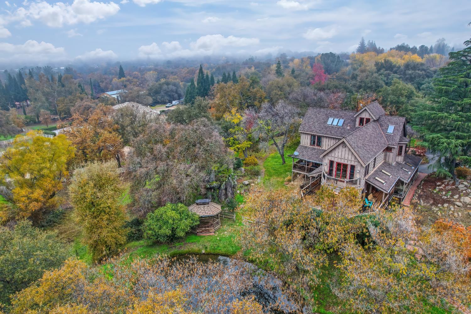 9475 King Road Loomis, CA 95650 - Photo 95 of 96 an aerial view of a house with a yard and mountain view in back