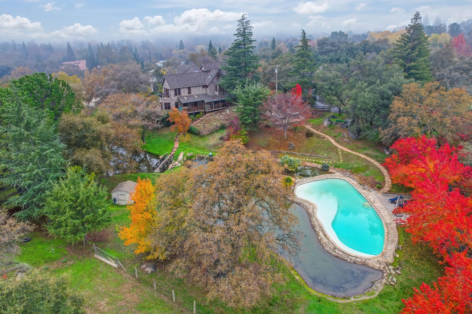 9475 King Road Loomis, CA 95650 - Photo 96 of 96 an aerial view of a house with a yard and lake view