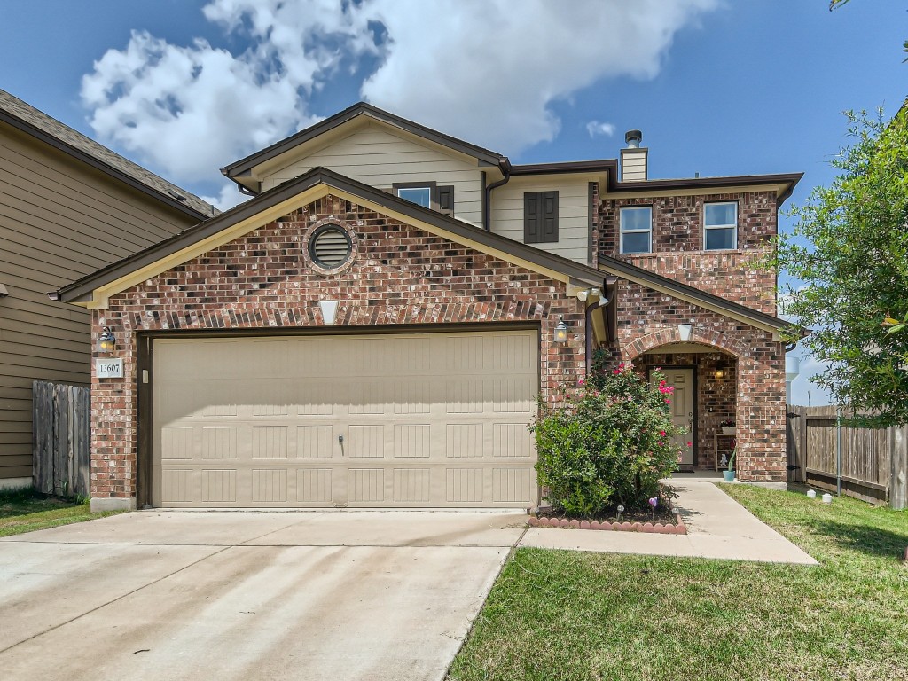 13607 Benjamin Harrison Street Manor, TX 78653 - Photo 1 of 1 a front view of a house with garden