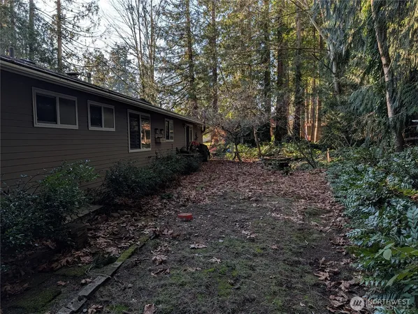 a backyard of a house with lots of green space