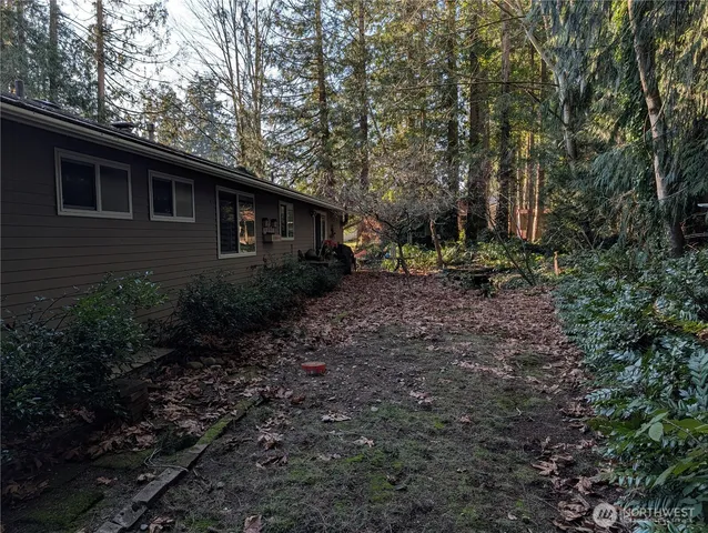 a backyard of a house with lots of green space