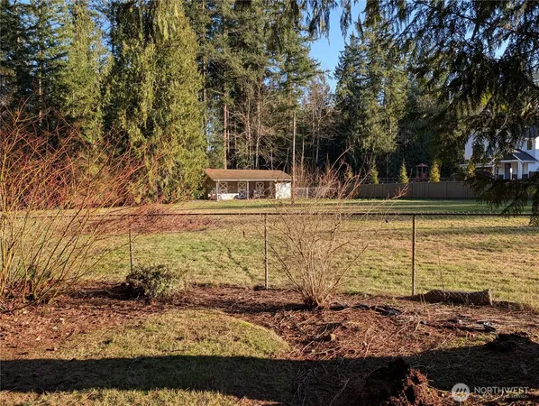 a view of a yard with patio