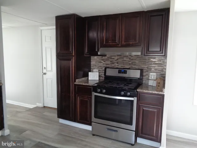 a kitchen with a stove and a cabinet