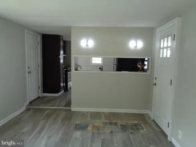 a view of a livingroom with wooden floor