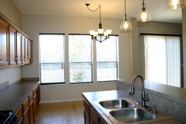 3077 Border Creek Drive Crestview, FL 32539 - Photo 11 of 33 a kitchen with a sink a counter top space and a window