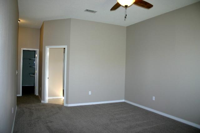 3077 Border Creek Drive Crestview, FL 32539 - Photo 19 of 33 a view of an empty room with a ceiling fan