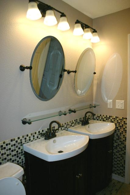 3077 Border Creek Drive Crestview, FL 32539 - Photo 30 of 33 a bathroom with a sink and a mirror