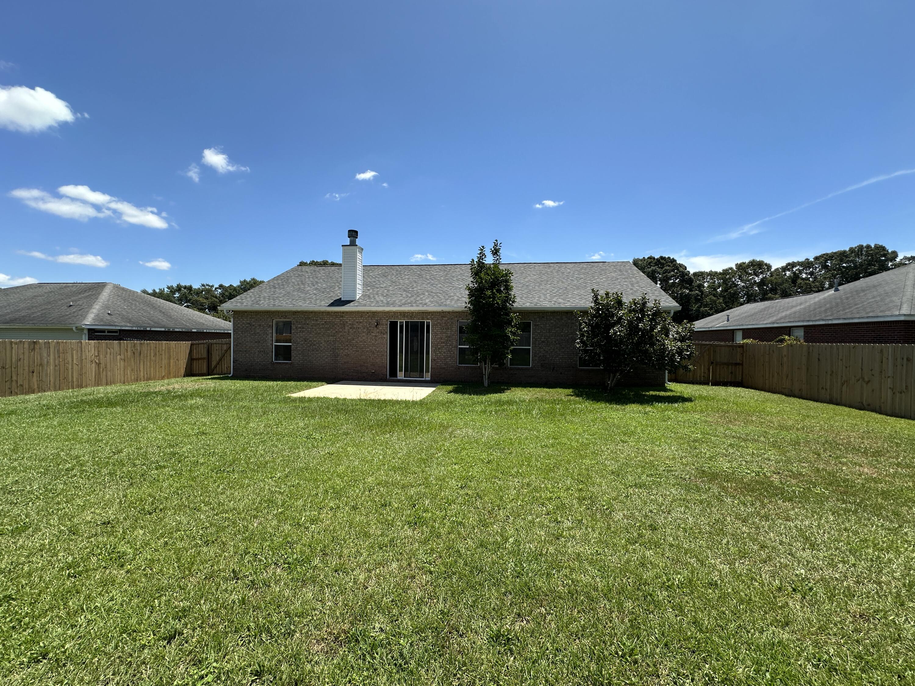3077 Border Creek Drive Crestview, FL 32539 - Photo 33 of 33 a front view of a house with a yard and a garage