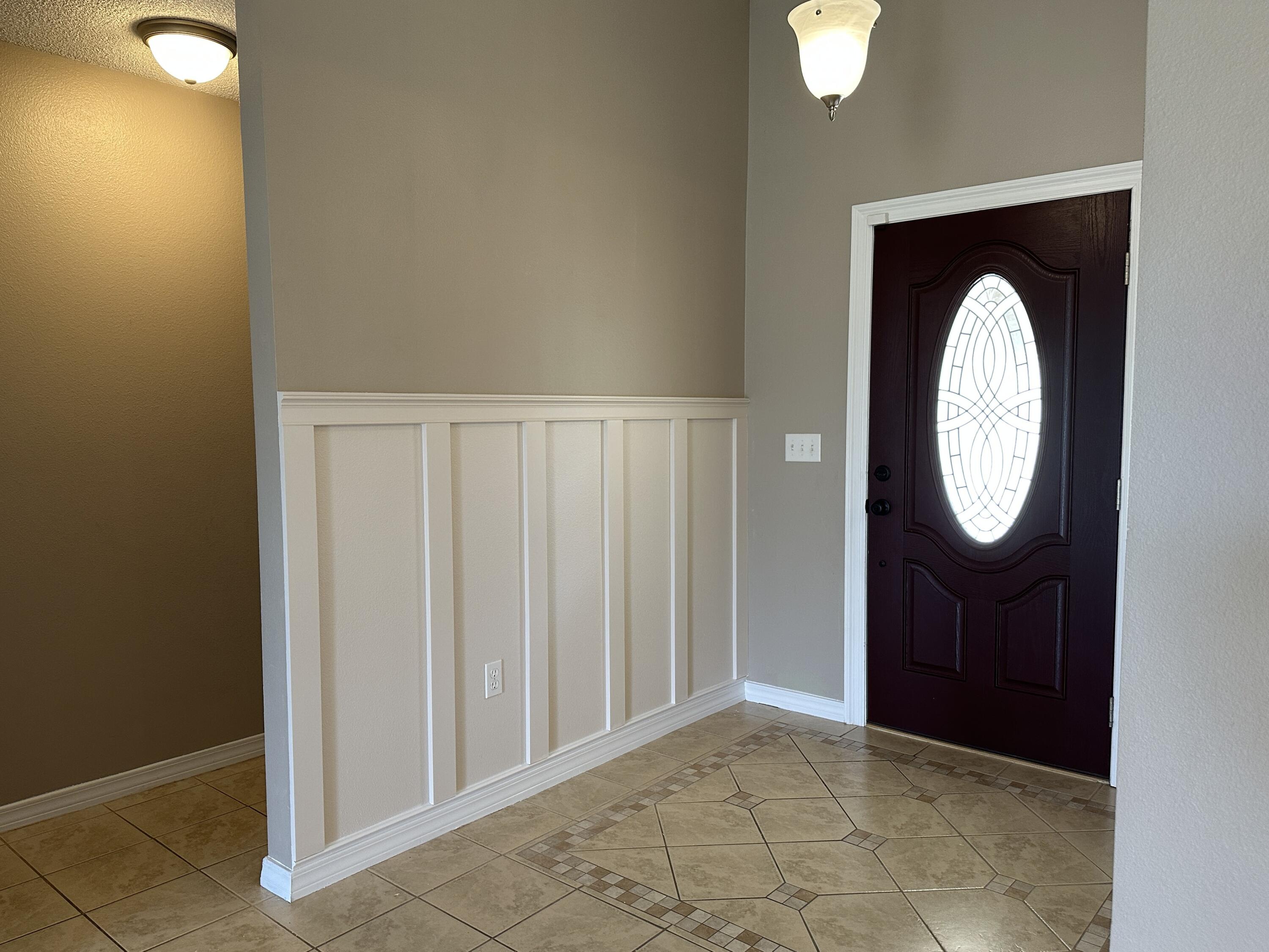 3077 Border Creek Drive Crestview, FL 32539 - Photo 7 of 33 a view of a hallway with washer and dryer