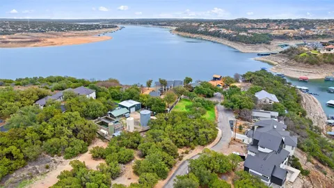 an aerial view of multiple house with a lake view