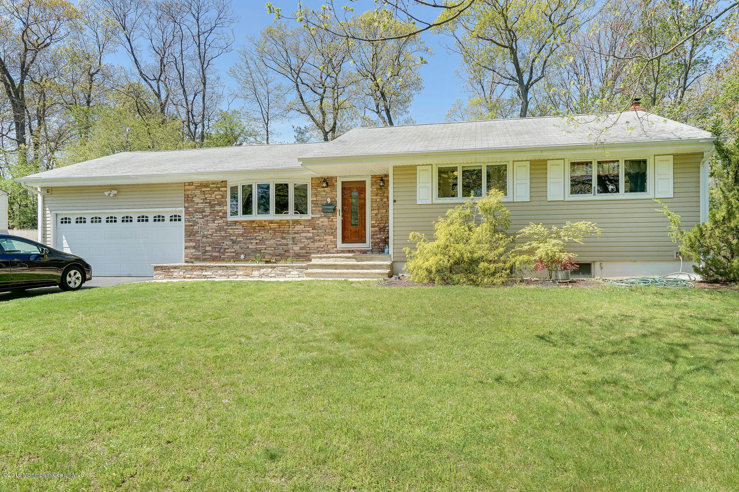 9 Chestnut Ridge Road Holmdel, NJ 07733 - Photo 1 of 39 a front view of a house with garden