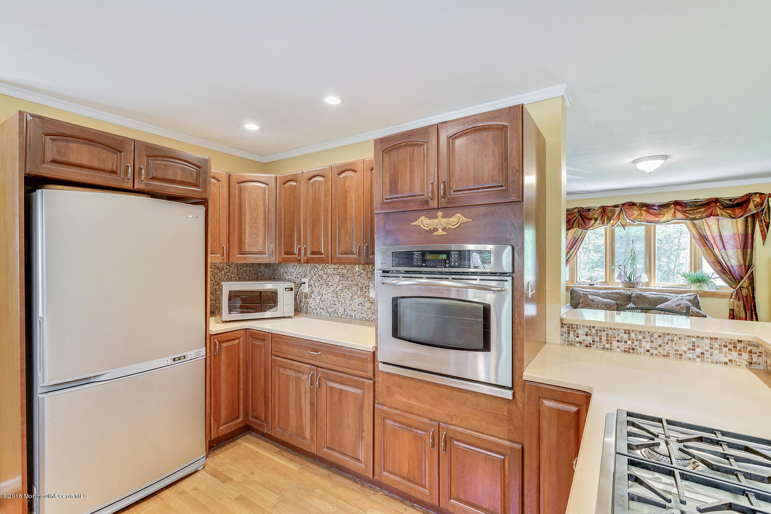 9 Chestnut Ridge Road Holmdel, NJ 07733 - Photo 20 of 39 a kitchen with a refrigerator sink and cabinets