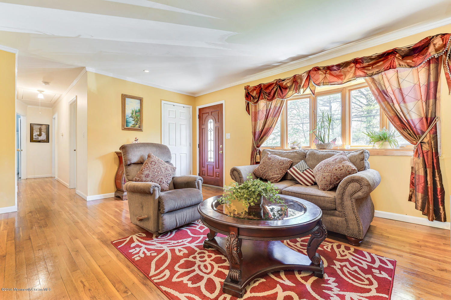 9 Chestnut Ridge Road Holmdel, NJ 07733 - Photo 2 of 39 a living room with furniture and a large window