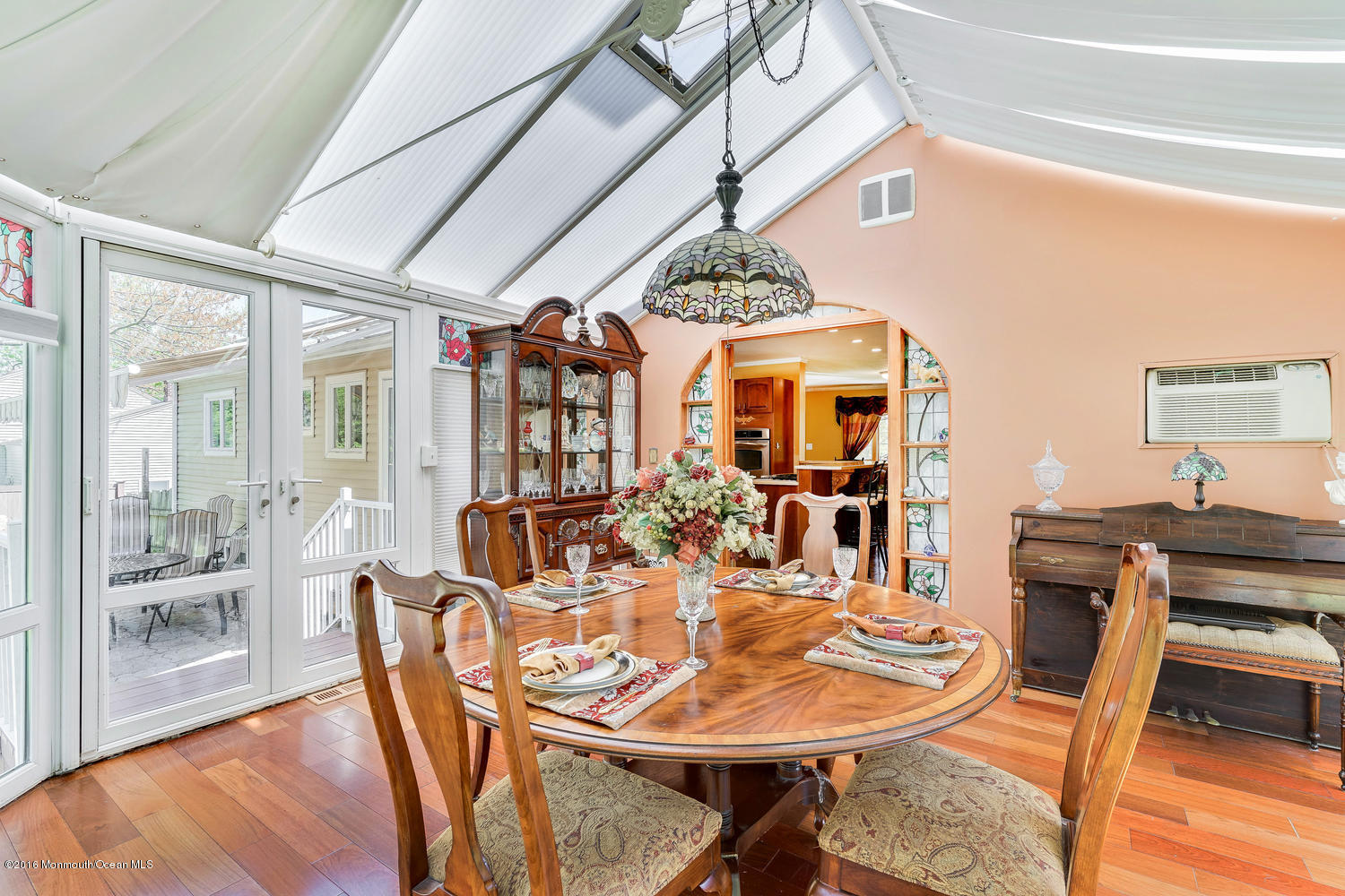 9 Chestnut Ridge Road Holmdel, NJ 07733 - Photo 22 of 39 a view of a dining room with furniture window and wooden floor