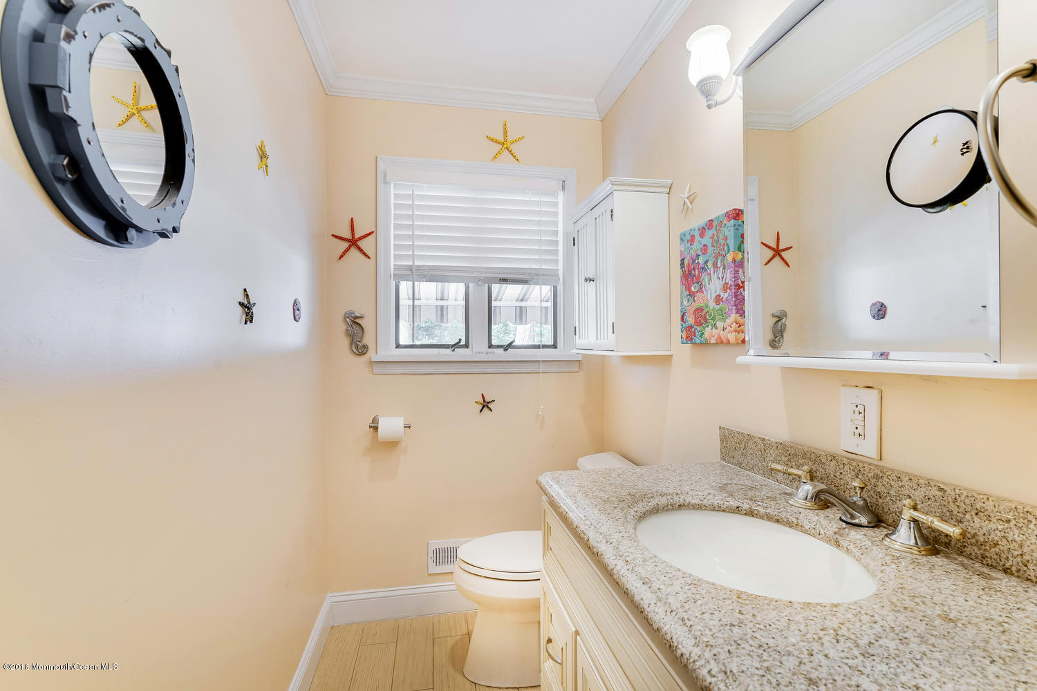 9 Chestnut Ridge Road Holmdel, NJ 07733 - Photo 25 of 39 a bathroom with a granite countertop toilet a sink and a mirror