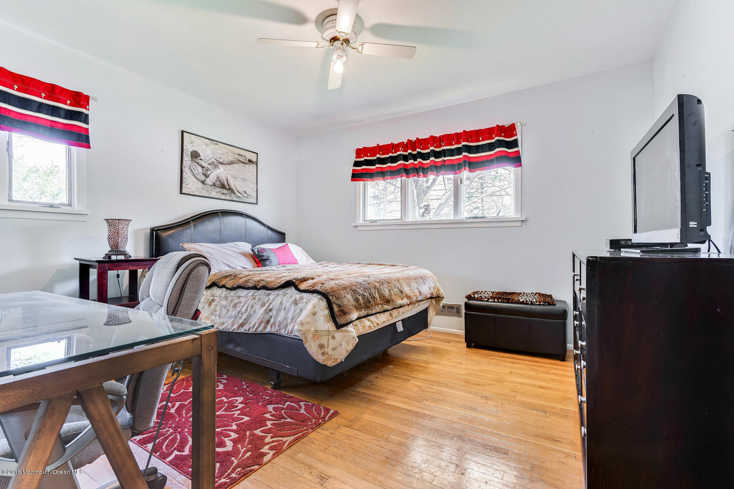 9 Chestnut Ridge Road Holmdel, NJ 07733 - Photo 26 of 39 a bedroom with a bed window and dresser