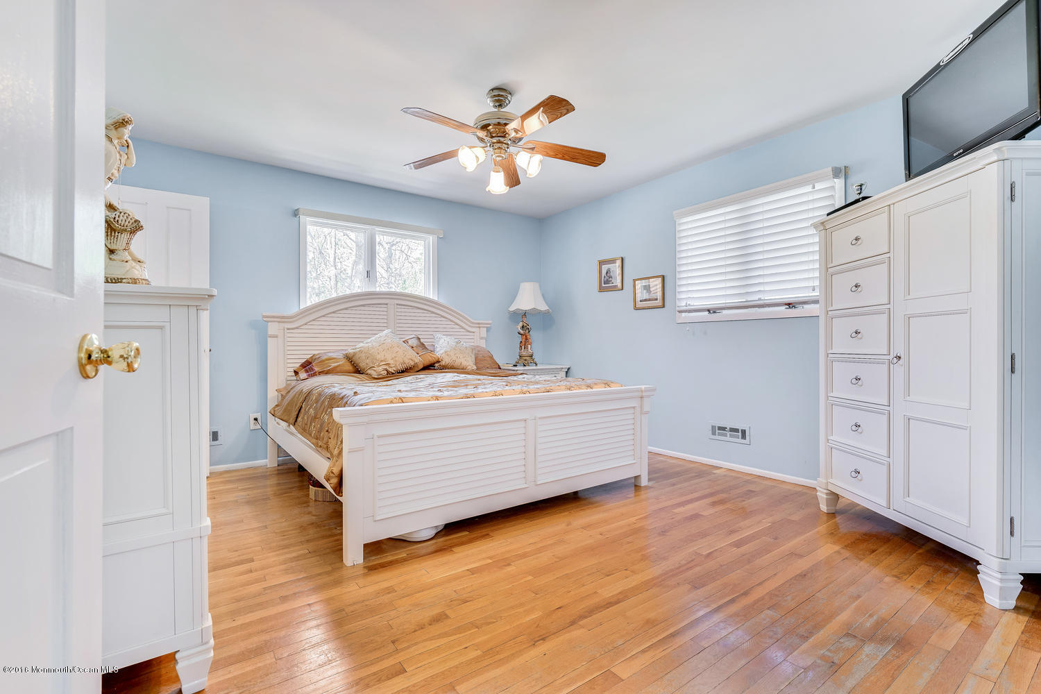 9 Chestnut Ridge Road Holmdel, NJ 07733 - Photo 28 of 39 a living room with furniture and a wooden floor