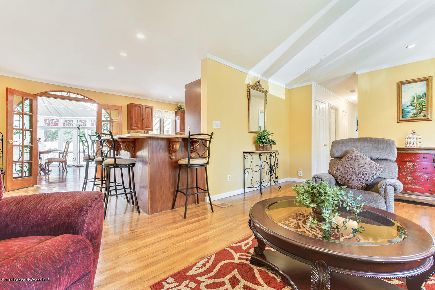 9 Chestnut Ridge Road Holmdel, NJ 07733 - Photo 3 of 39 a living room with furniture and a dining table