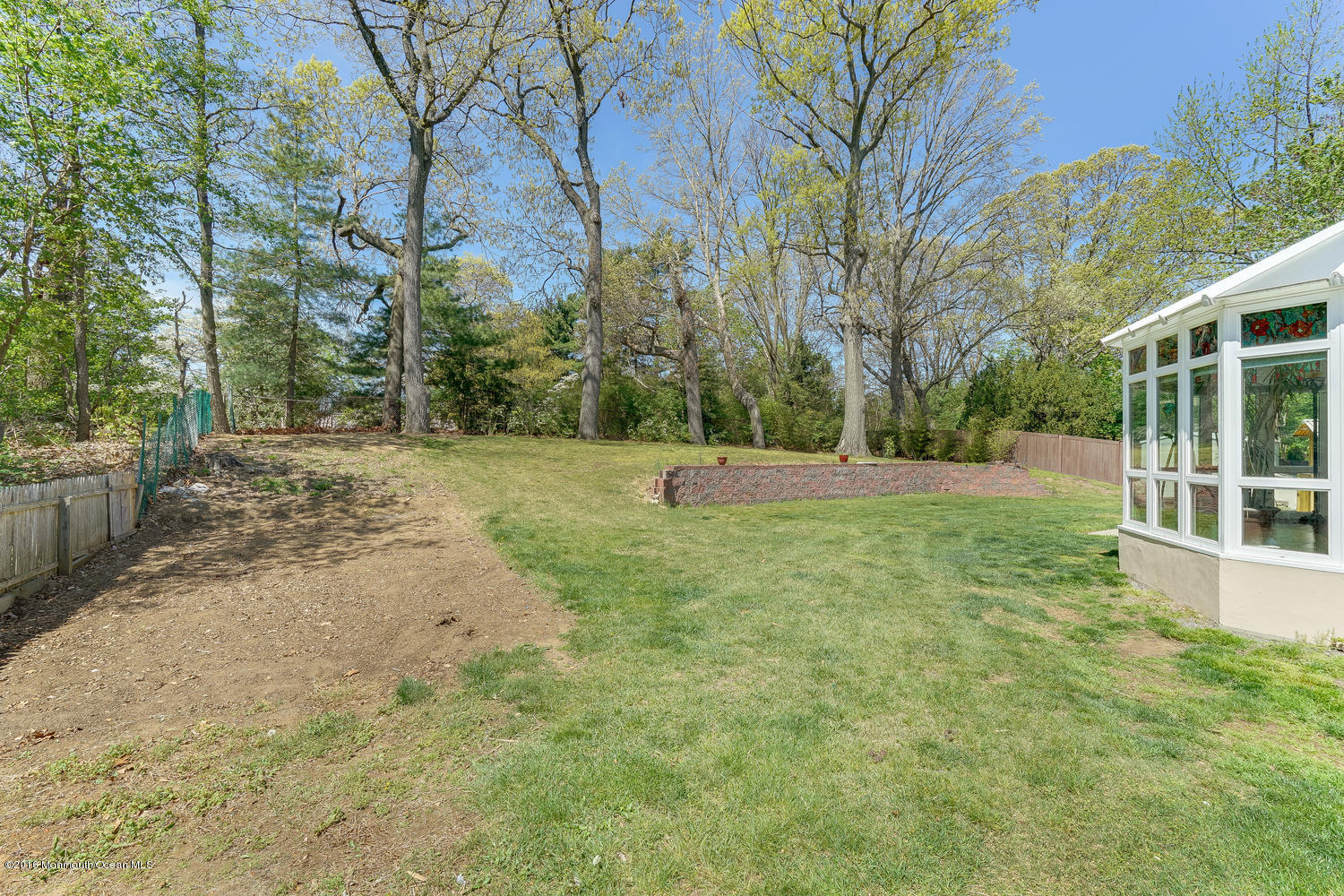 9 Chestnut Ridge Road Holmdel, NJ 07733 - Photo 35 of 39 a view of outdoor space with deck and tree