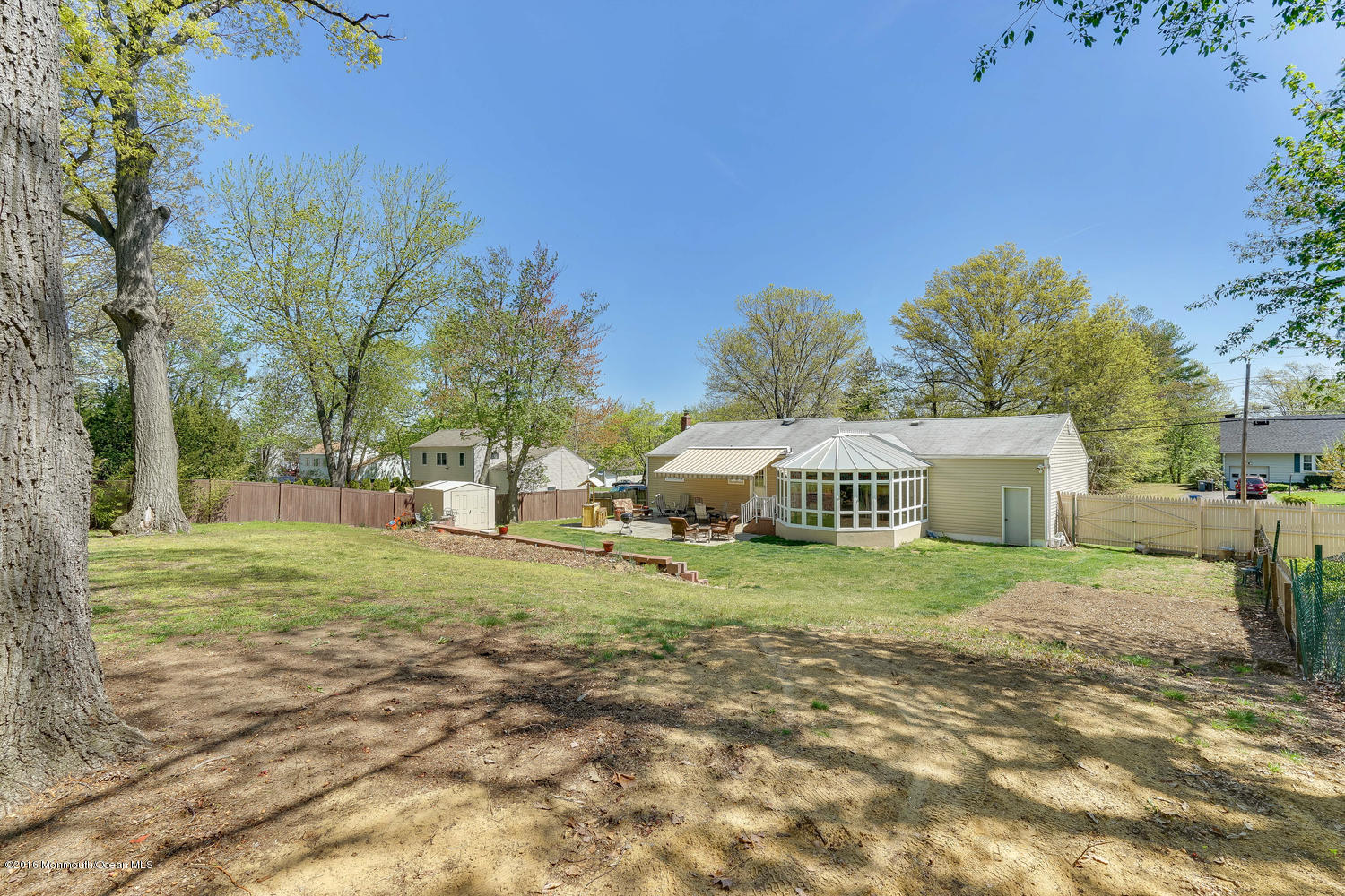 9 Chestnut Ridge Road Holmdel, NJ 07733 - Photo 36 of 39 a front view of a house with a yard and trees