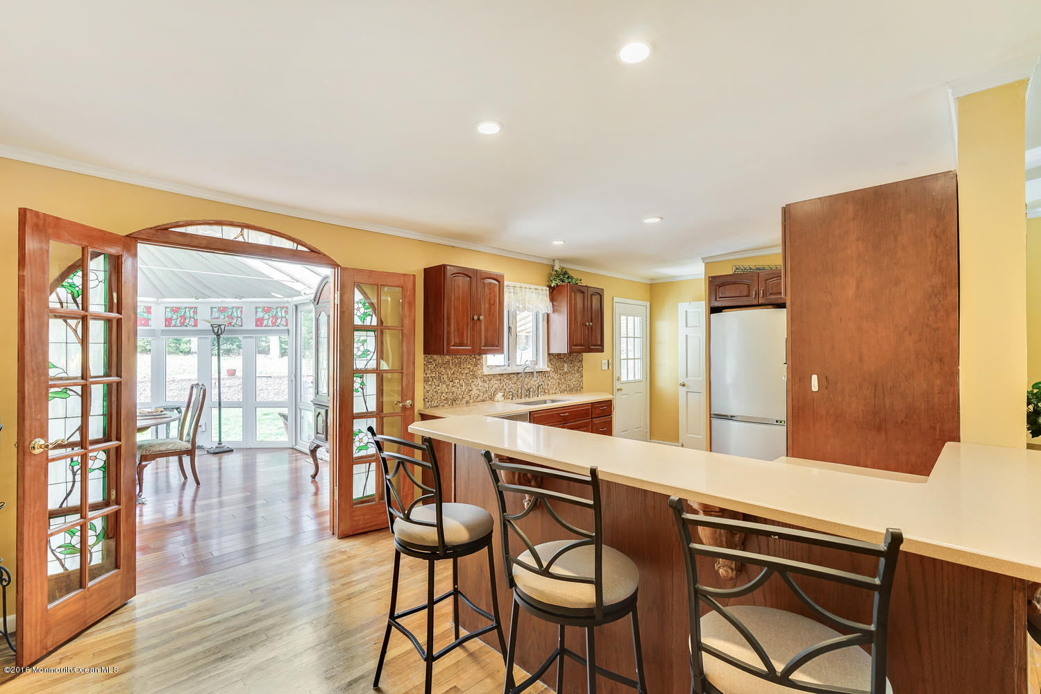 9 Chestnut Ridge Road Holmdel, NJ 07733 - Photo 4 of 39 a large kitchen with a table and chairs
