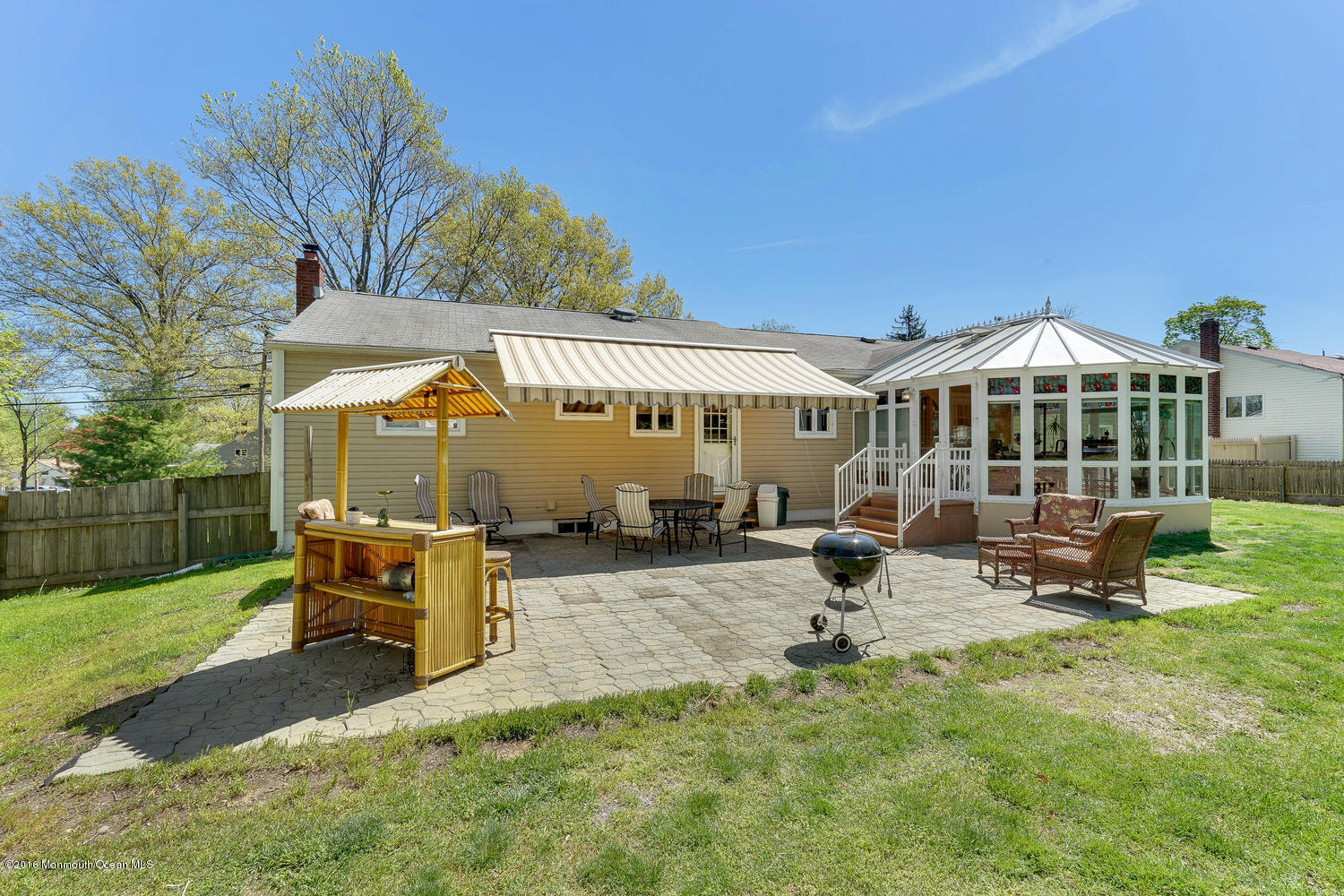 9 Chestnut Ridge Road Holmdel, NJ 07733 - Photo 6 of 39 a view of a house with backyard porch and sitting area