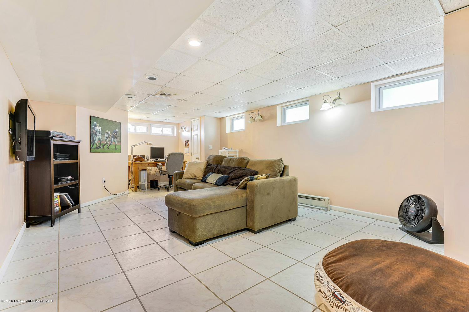 9 Chestnut Ridge Road Holmdel, NJ 07733 - Photo 7 of 39 a living room with furniture and a flat screen tv