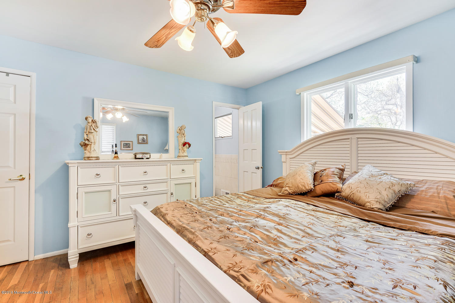 9 Chestnut Ridge Road Holmdel, NJ 07733 - Photo 8 of 39 a bedroom with a bed and a chandelier