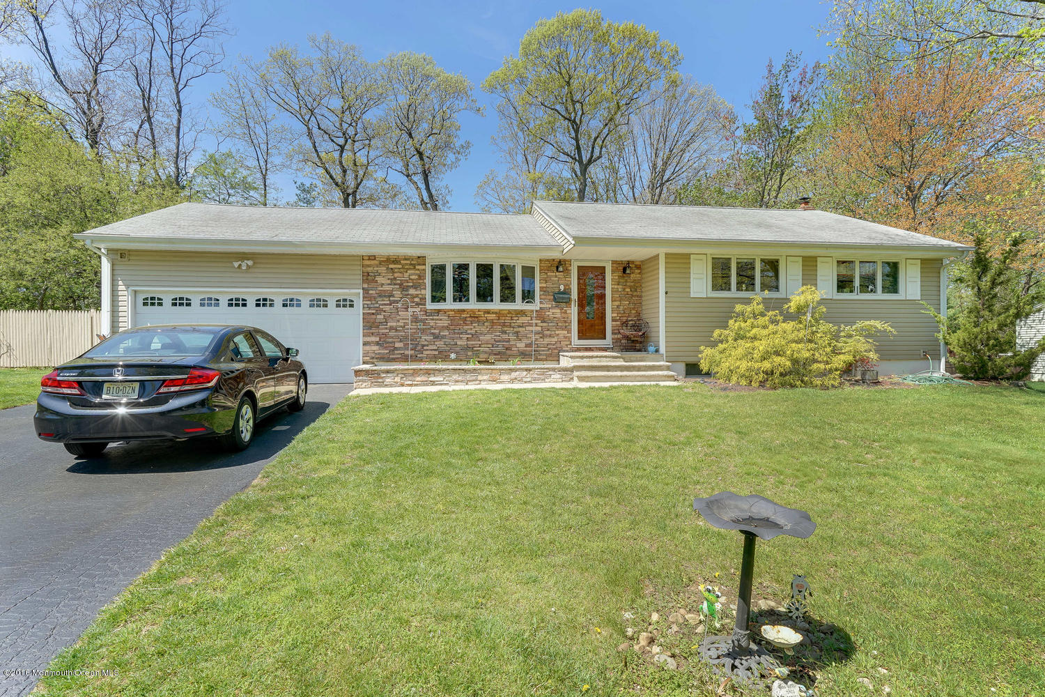 9 Chestnut Ridge Road Holmdel, NJ 07733 - Photo 9 of 39 a front view of a house with garden