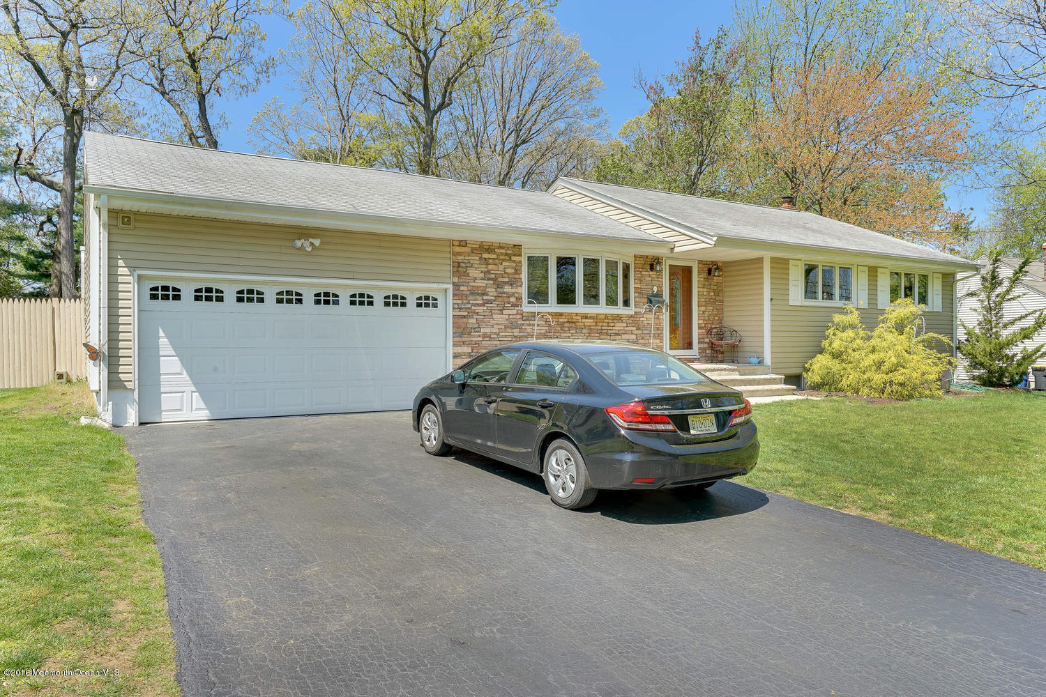 9 Chestnut Ridge Road Holmdel, NJ 07733 - Photo 10 of 39 a car parked in front of a house