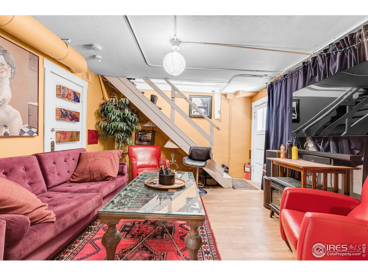 834-836 13th Street Boulder, CO 80302 - Photo 11 of 40 a living room with furniture and a large window
