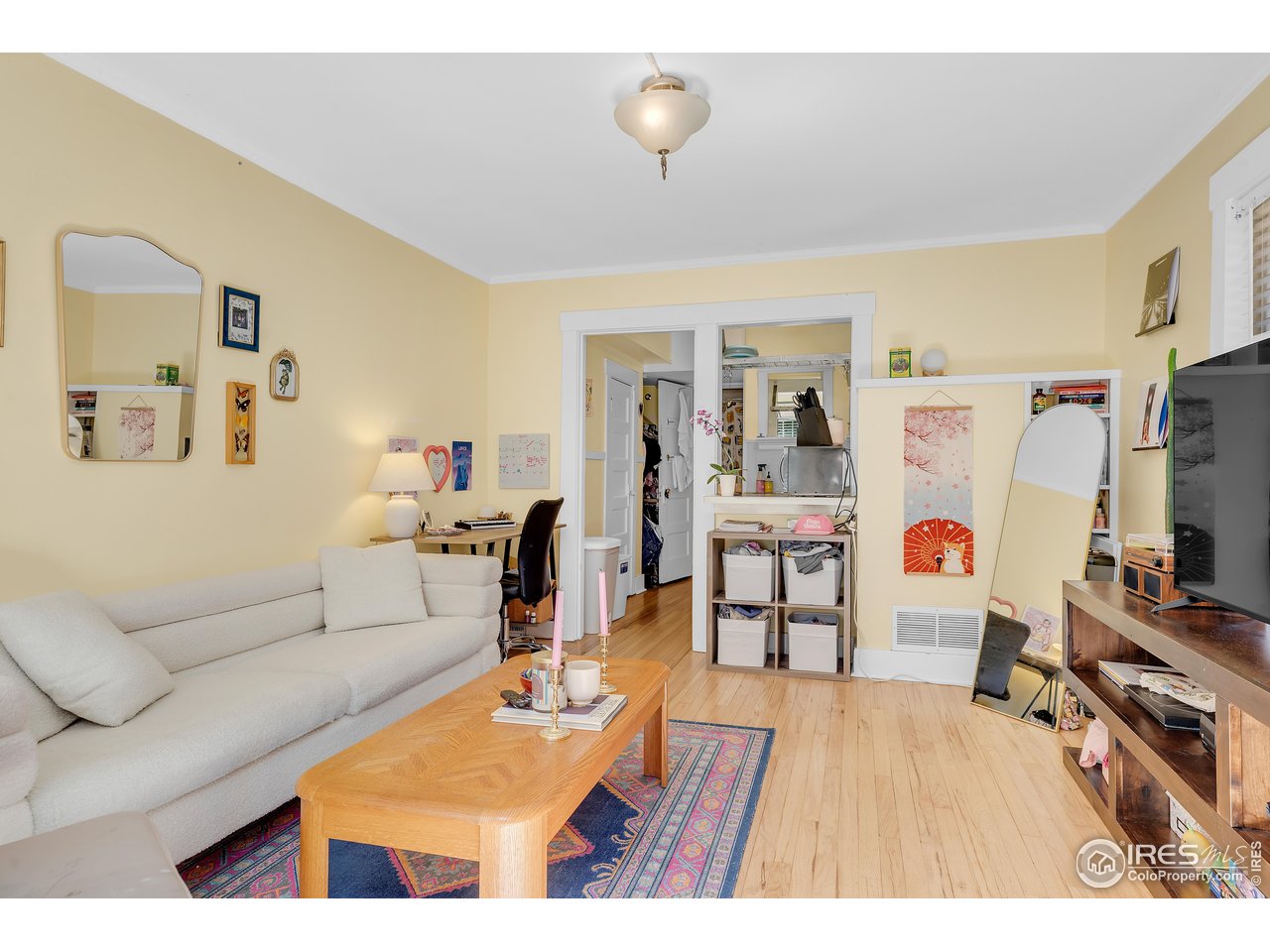 834-836 13th Street Boulder, CO 80302 - Photo 18 of 40 a living room with furniture and a flat screen tv